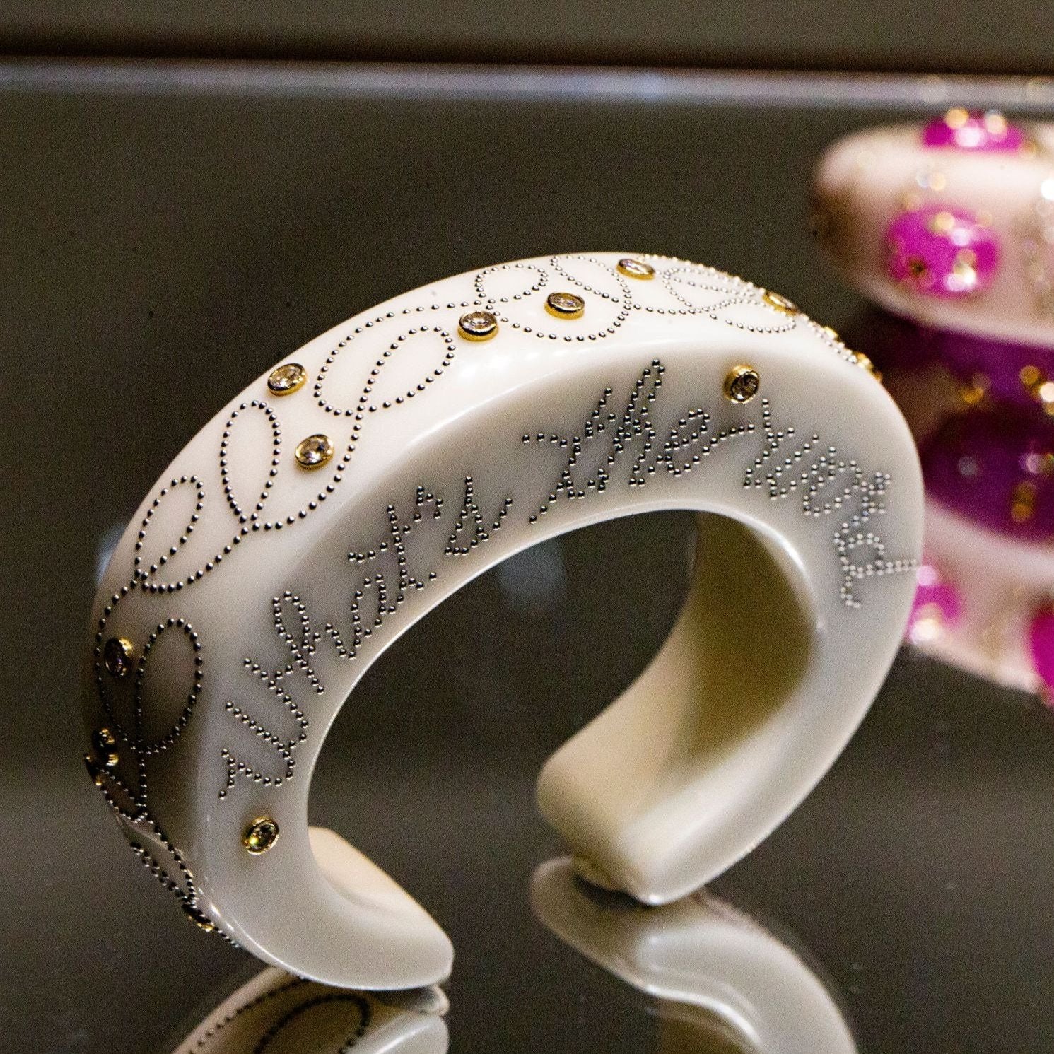 BAKELITE, STEEL, GOLD, AND DIAMOND CUFF BRACELET BY DANIEL BRUSH, NEW YORK, CIRCA 2004