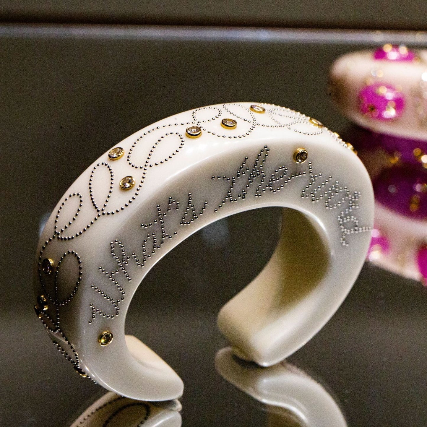BAKELITE, STEEL, GOLD, AND DIAMOND CUFF BRACELET BY DANIEL BRUSH, NEW YORK, CIRCA 2004