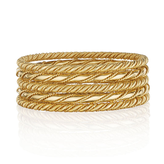 FIVE GOLD ROPE TWIST BANGLE BRACELETS BY CARTIER, CIRCA 1950