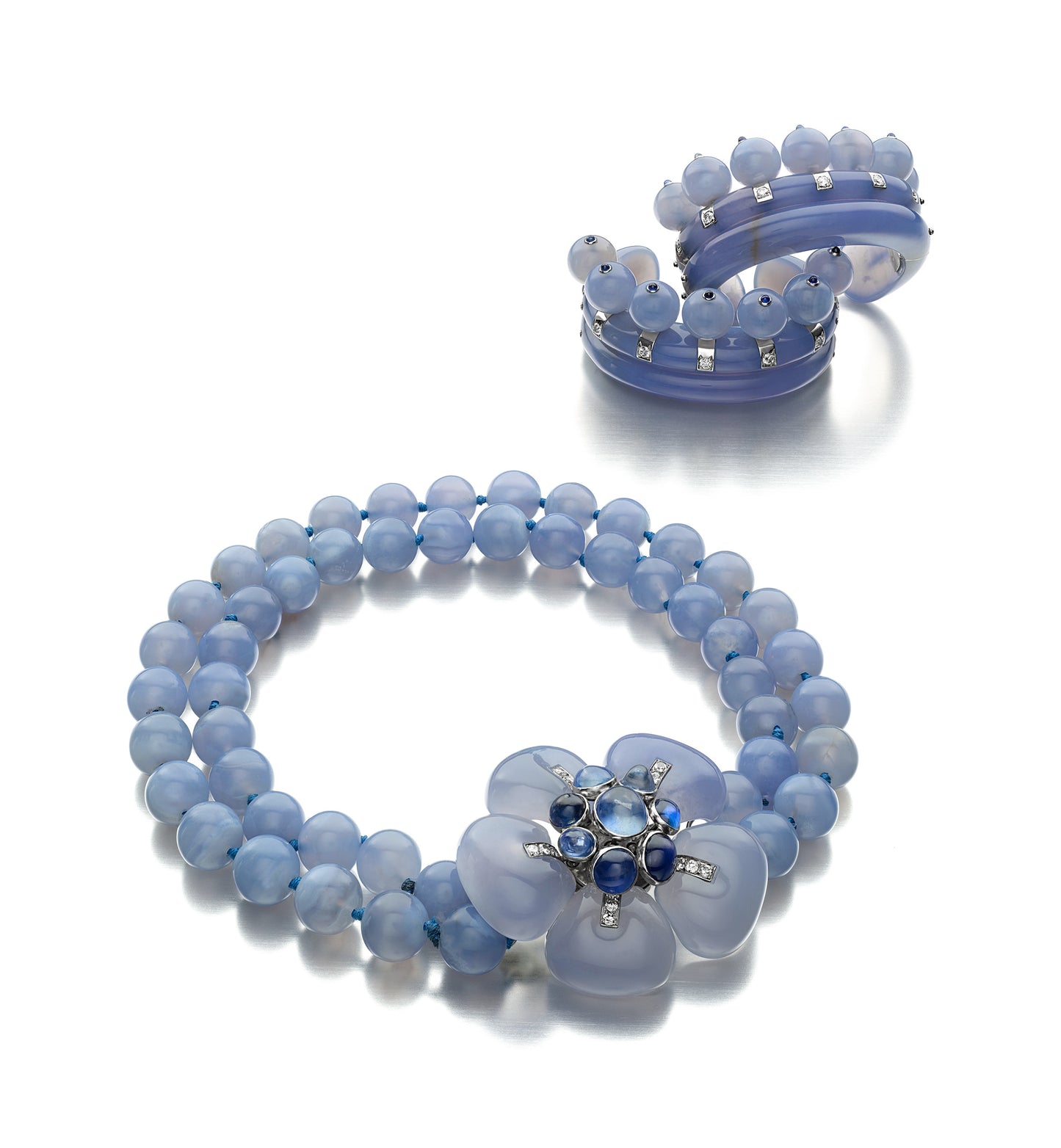 THE DUCHESS OF WINDSOR SUITE: AN ART MODERNE BLUE CHALCEDONY, SAPPHIRE, AND DIAMOND SUITE OF JEWELRY BY SUZANNE BELPERRON, PARIS, CIRCA 1935