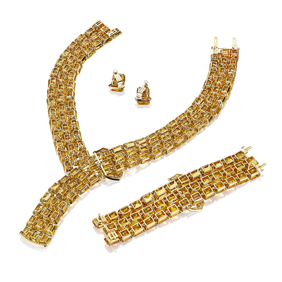 THE TIBBETT SUITE: A CITRINE AND DIAMOND BELT WITH A BUCKLE NECKLACE AND EARRINGS BY PAUL FLATO, NEW YORK, CIRCA 1940, BRACELET BY LAMBERT BROTHERS, NEW YORK, CIRCA 1950