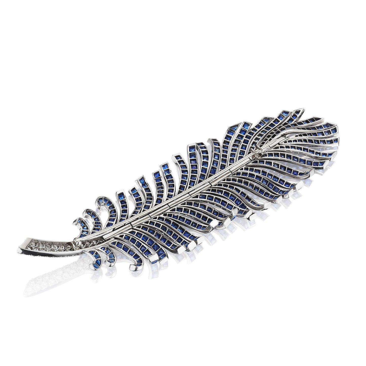 SAPPHIRE AND DIAMOND FEATHER BROOCH BY PAUL FLATO, NEW YORK, CIRCA 1940