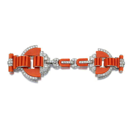 ART DECO CORAL AND DIAMOND CLOAK CLASP CONVERTIBLE TO CLIPS BY CARTIER, LONDON, CIRCA 1925