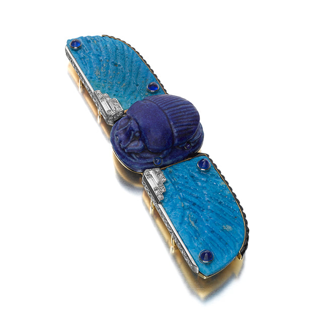 THE COLE PORTER SCARAB: AN ART DECO EGYPTIAN FAIENCE, BLACK ENAMEL, SAPPHIRE, AND DIAMOND BELT BUCKLE BROOCH BY CARTIER, PARIS, 1926