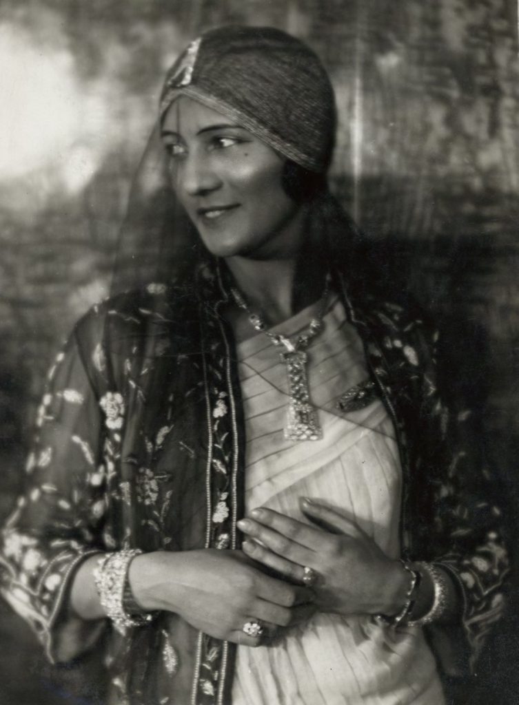 A  model  wearing  Sandoz  jewelry  including  a  geometric  rock  crystal, onyx,  and  diamond  brooch  pinned  to  her  turban,  circa  1927.