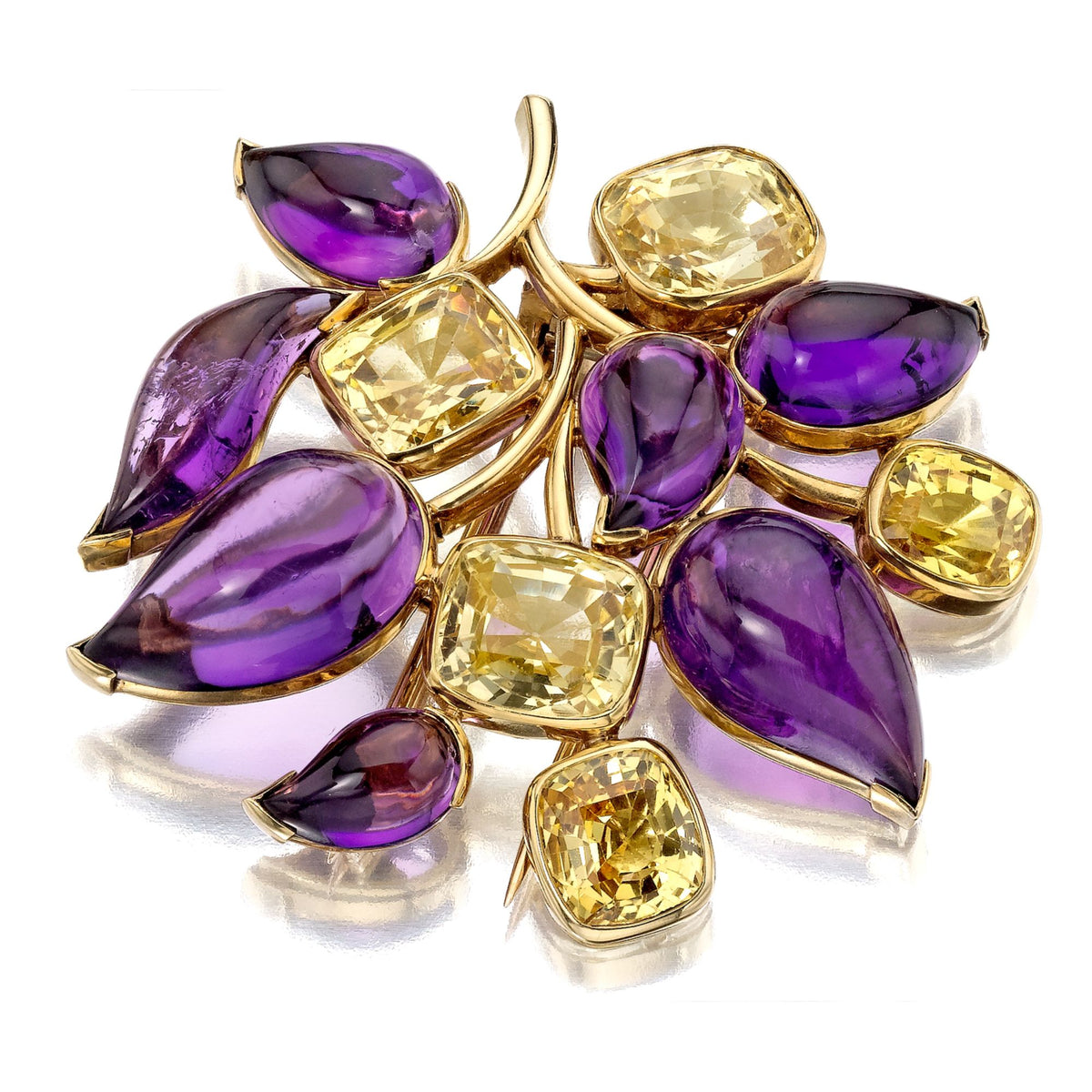 SUITE OF AMETHYST, YELLOW SAPPHIRE, AND CITRINE BROOCH, EAR CLIPS, AND RING BY SUZANNE BELPERRON, PARIS, 1951
