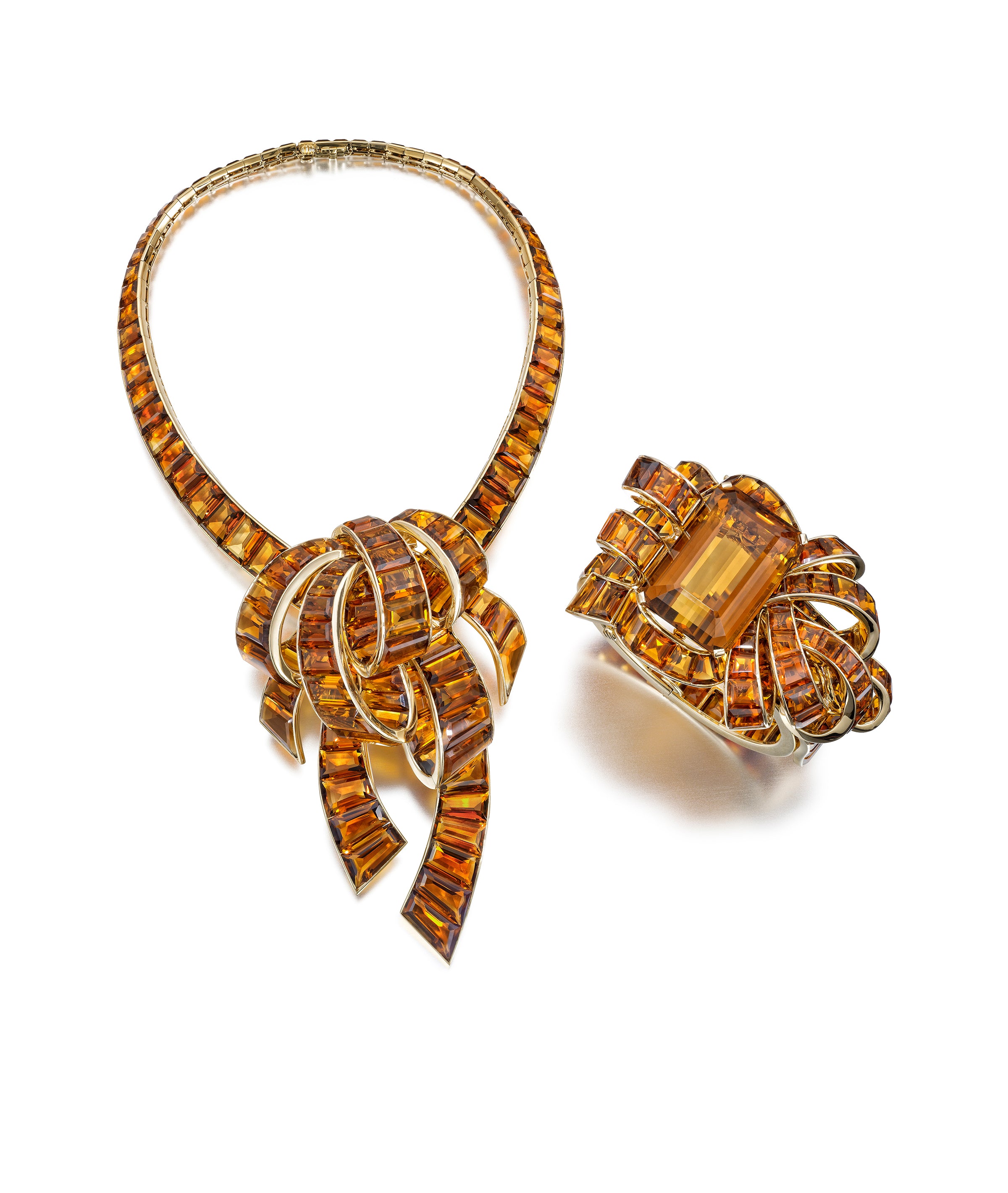 MODERNE  CITRINE  AND  GOLD  NECKLACE,  BROOCH,  AND  BRACELET  SUITE BY  TRABERT  &  HOEER-MAUBOUSSIN,  NEW  YORK,  CIRCA  1940